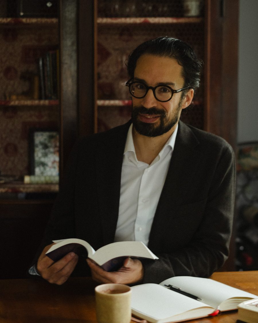 Noel Garcia reading at his desk